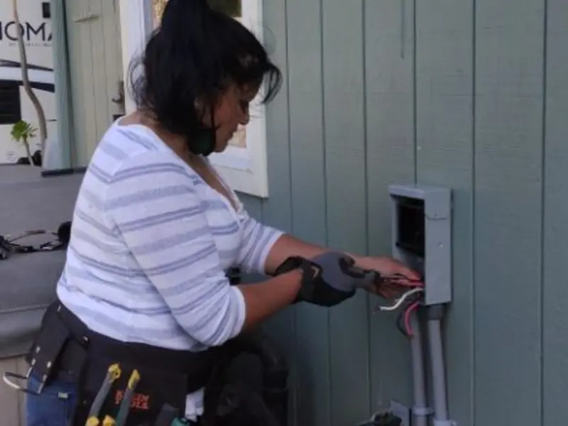 Licensed electrician wiring an exterior subpanel in Box Elder
